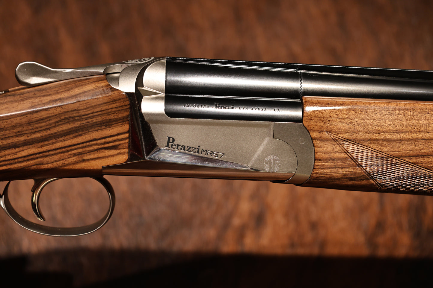 close up of Perazzi MR57S right side view with hand engravings, for sale at Berg's Outdoors
