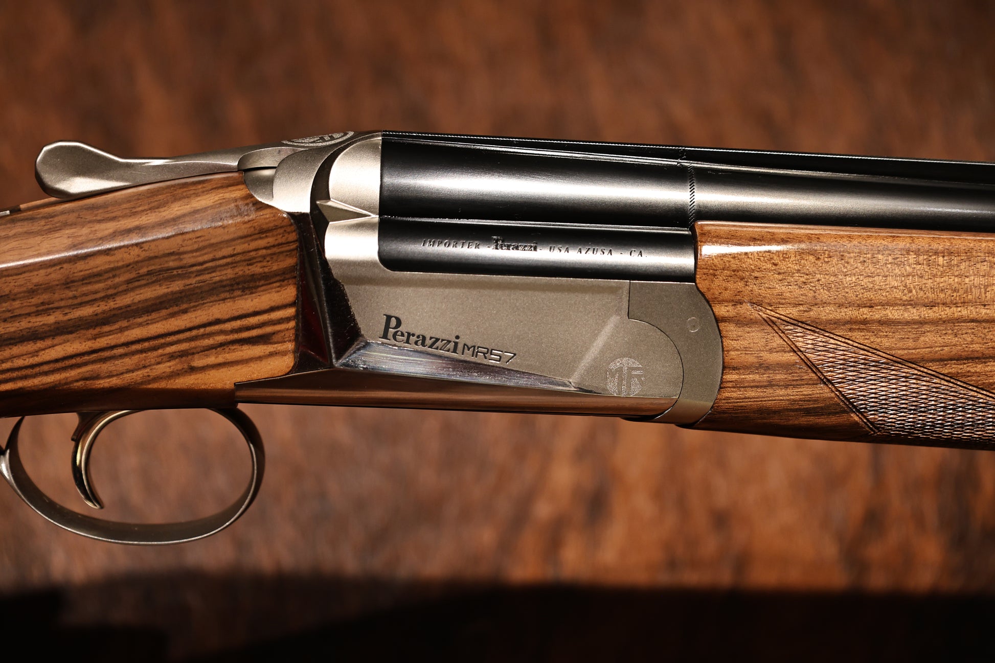 close up of Perazzi MR57S right side view with hand engravings, for sale at Berg's Outdoors