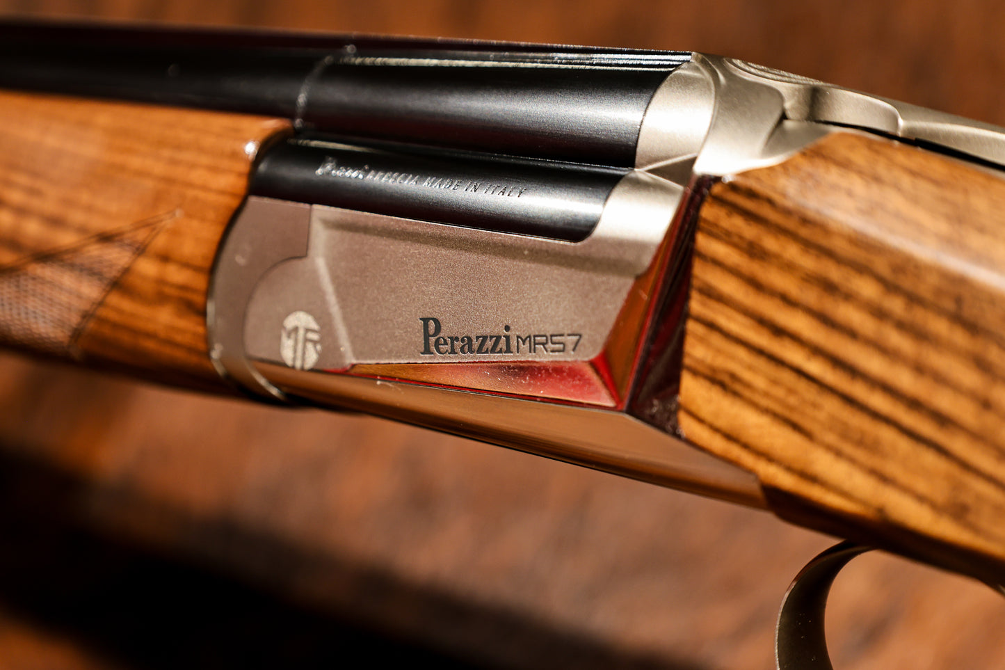 close up of Perazzi MR57S left side view on angle showing MR and Perazzi MR57 engraving, for sale at Berg's Outdoors 