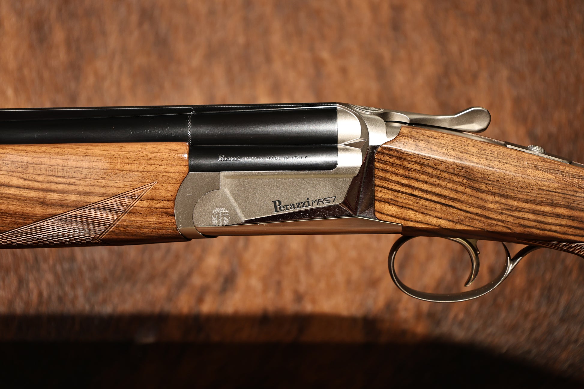 close up of Perazzi MR57S left side view with engraving, for sale at Berg's Outdoors