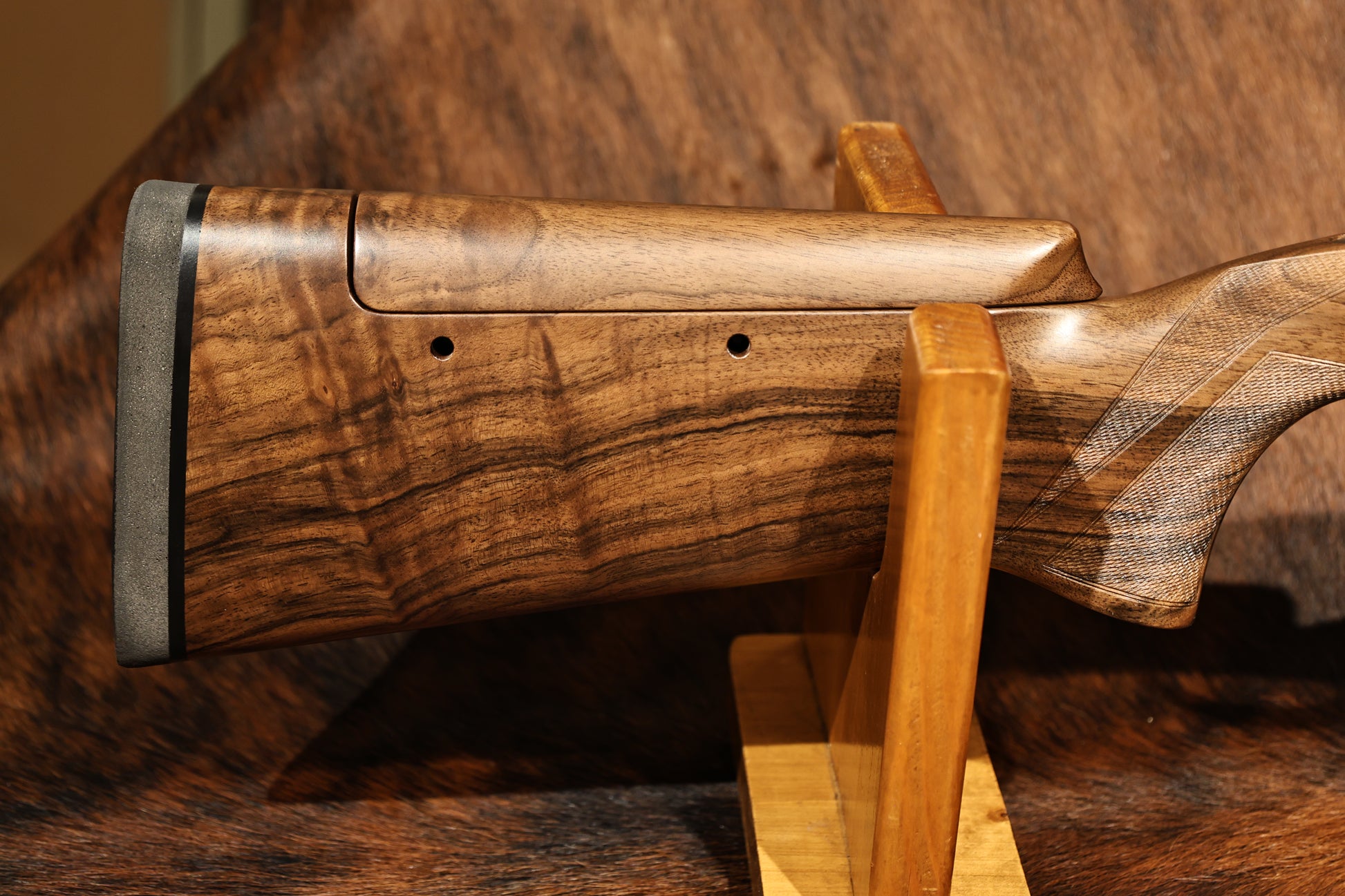 close up of left handed Perazzi MR57 right side of stock, for sale at Berg's Outdoors